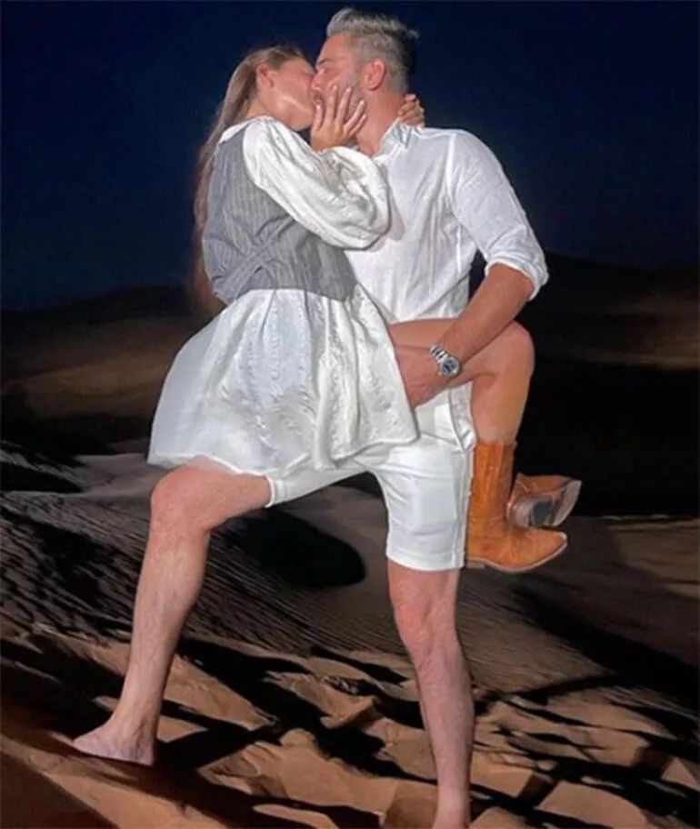 Kadir Doğulu and Neslihan Atagül Kissing at Beach